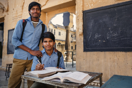 JAIPUR, INDIA - JANUARY 10, 2015: Two Indian male students with books on January 10, 2015 in Jaipur, Indiaのeditorial素材