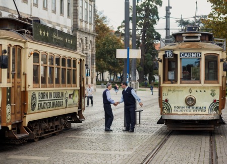 PORTO, PORTUGAL - OCTOBER 19, 2015: Drivers of Famous old tram on street of Porto. Trams operating in Porto since 1872のeditorial素材