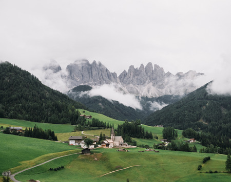 Daytime view of Santa Maddalena town in Dolomite mountains, Italyの写真素材