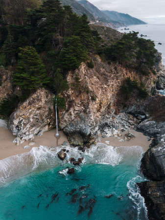 Aerial view of McWay Falls on the coast of Californiaの写真素材