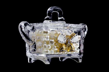 glass box with pearls on a black background isolateの写真素材