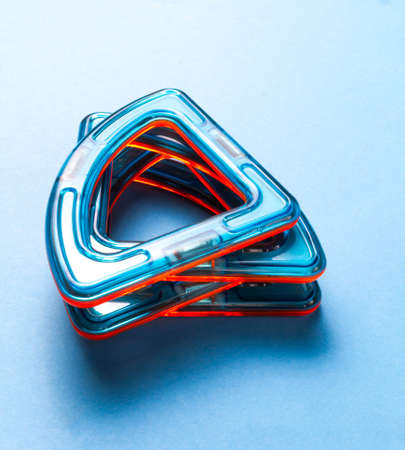 Children's toy constructor on magnets on a blue backgroundの写真素材