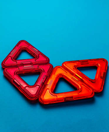 Children's toy constructor on magnets on a blue background