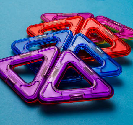 Children's toy constructor on magnets on a blue background