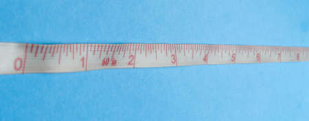 meter for marking in inches on magnets on a blue background