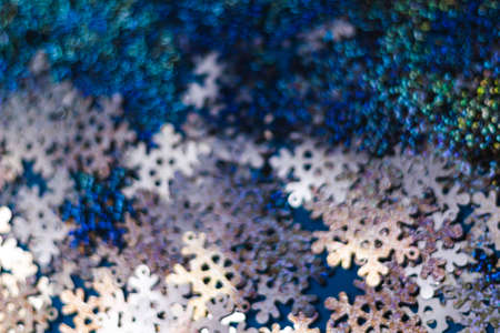 Snowflakes blur bokeh on a blue background. copy space