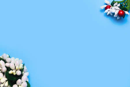 artificial roses on a blue background frame for text. copy spaceの写真素材