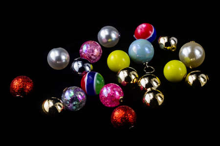 A variety of Christmas balls on a black backgroundの写真素材