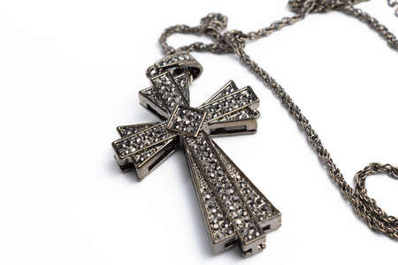 Big cross with rhinestones on a white background isolateの写真素材