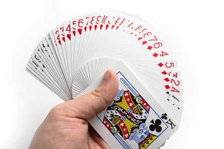 Card fan in hand on a white background isolate