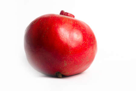 Red ripe pomegranate on a white background isolateの写真素材