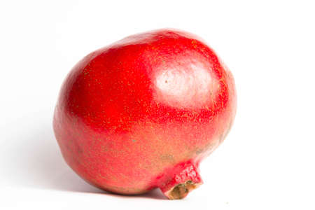 Red ripe pomegranate on a white background isolateの写真素材