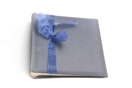 Gift album for photo with bow on isolate white background.の写真素材