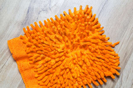 Hairy rag for cleaning on a wooden parquet
