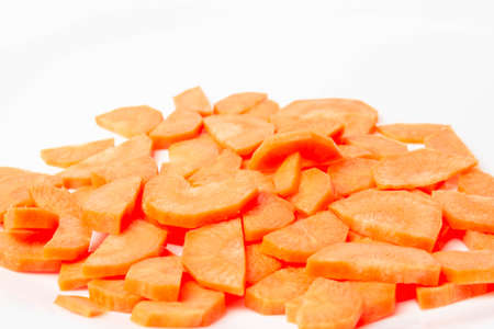 Slices of fresh ripe carrots on a white background isolateの写真素材