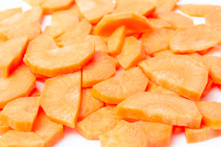 Slices of fresh ripe carrots on a white background isolateの写真素材
