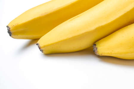 Bunch of ripe yellow bananas on a white background isolateの写真素材