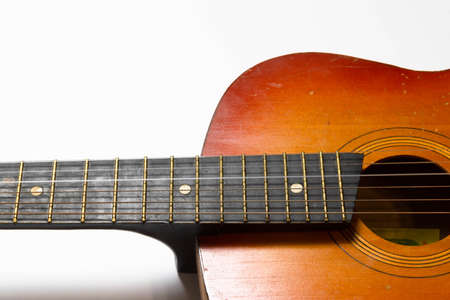 Acoustic guitar on a white background