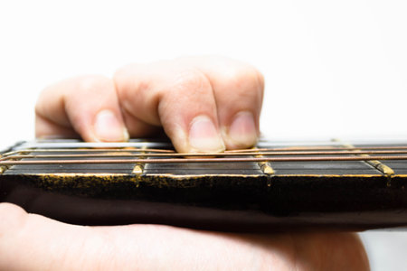 finger chords acoustic guitar on white background