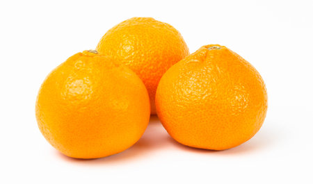 Ripe orange tangerines on a white backgroundの写真素材
