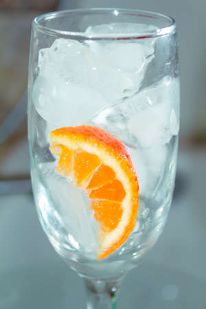 champagne glass with cocktail oranges with ice close upの写真素材