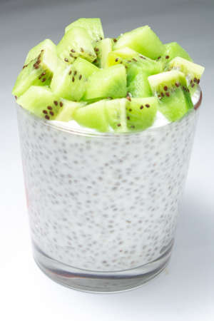 healthy breakfast of chia yogurt and kiwi seeds on a wooden background. copy spaceの写真素材