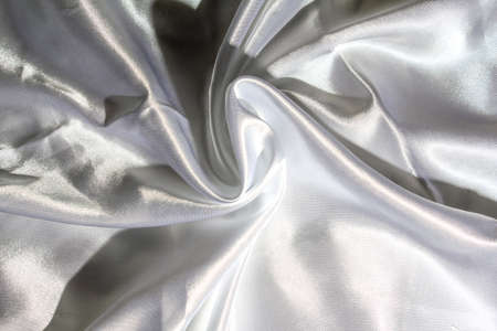 White silk fabric with bends texture. copy spaceの写真素材