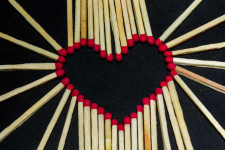 match heart on a dark background close up. copy spaceの写真素材