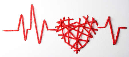 heart with pulse with drops made of red thread Valentine's Day love on a white background. copy spaceの写真素材