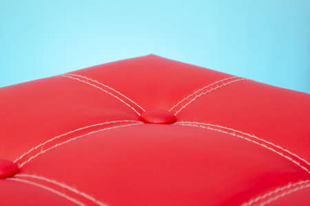 red leather on a blue background. close up copy spaceの写真素材