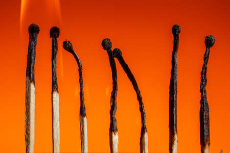 burning seven matches in a row in the corners of a leadership chart on a Lush Lava background. close up copy spaceの写真素材