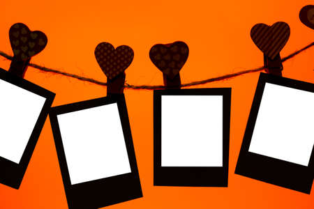 five paper clips of red clothespins with a heart on a rope. Valentine's Day love. Lush Lava...