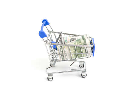 steel shopping trolley with hundred dollar rolls with blue inserts on a white background isolate