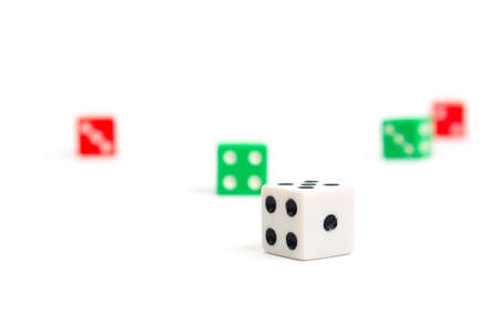 game dice scattered in white green and red on a white background isolate, side viewの写真素材
