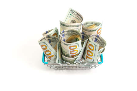 a basket with blue inserts is inserted into the wrapped one hundred dollar bills on a white background. isolateの写真素材