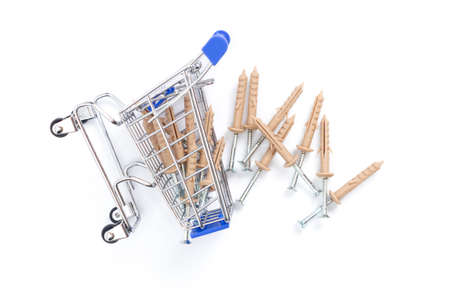 fallen shopping cart with screws for the wall on a white background. isolate, top view