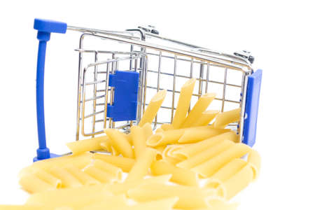 fallen shopping cart with pasta on a white background. isolate