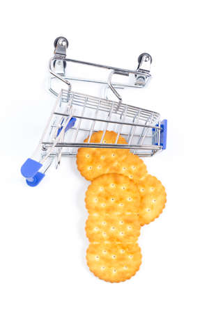 fallen shopping cart with crackers on a white background. isolate, top viewの写真素材