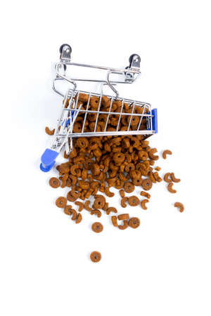 fallen shopping cart with food for animals, dogs, cats on a white background. isolate, top viewの写真素材