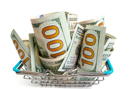 a basket with blue inserts is inserted into the wrapped one hundred dollar bills on a white background. isolateの写真素材