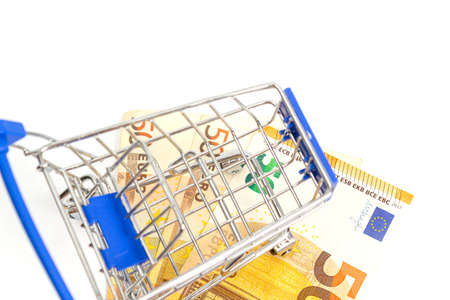 basket with blue inserts inserted worth fifty euro banknote on a white background. isolateの写真素材