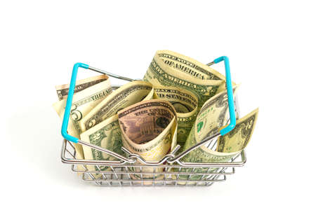 basket with blue inserts inserted into the wrapped dollar bills on a white background. isolateの写真素材