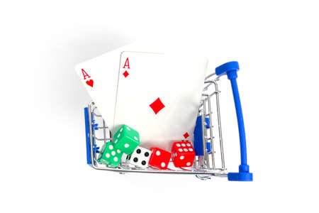shopping cart with playing cards two red aces diamond, heart and dice on a white background. isolateの写真素材