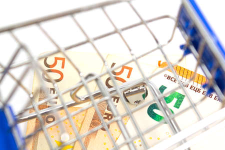 basket with blue inserts inserted worth fifty euro banknote on a white background. isolateの写真素材