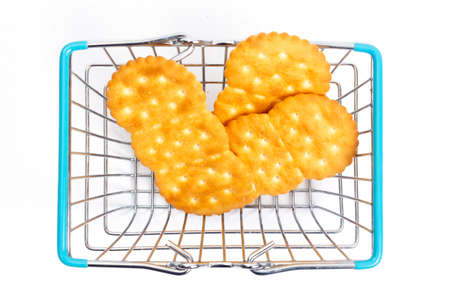 shopping basket with crackers on a white background. isolate, top viewの写真素材