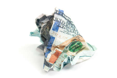 squeezed hundred dollar bill on a white background isolate, side viewの写真素材