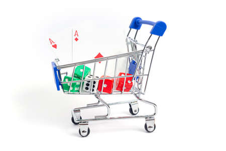 shopping cart with playing cards two red aces diamond, heart and dice on a white background. isolateの写真素材