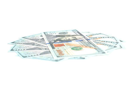 hundred dollar bills lie in the shape of a circle on a white background isolate, side viewの写真素材