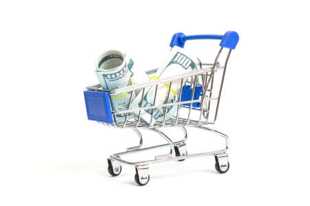 steel shopping trolley with hundred dollar rolls with blue inserts on a white background isolateの写真素材