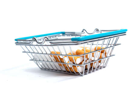 cigarette liners in a shopping basket on a white background. isolate